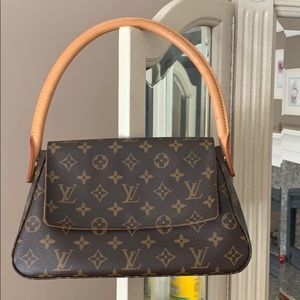 Great condition Louis Vuitton loop bag.